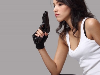 woman holding a gun contemplating suicide