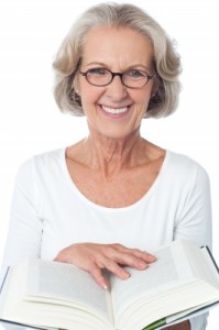 Smiling Senior Woman Reading A Book